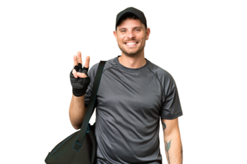 Young sport man with sport bag over isolated chroma key background happy and counting three with fingers