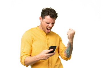 Brazilian man over isolated chroma key background with phone in victory position