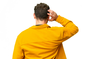 Brazilian man over isolated chroma key background in back position and thinking