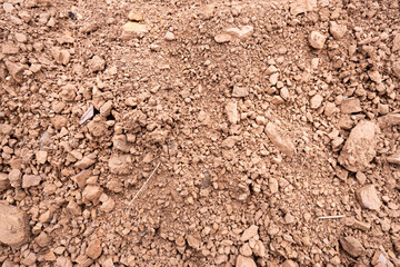 Weathered rock background. Brown highly weatered stone.