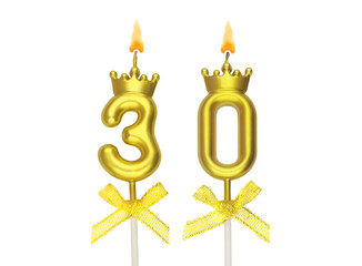 Burning gold birthday candles with crown isolated on white background, number 30.