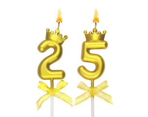 Burning golden birthday candles with crown isolated on white background, number 25.