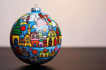 Unique Christmas bauble art. Comic style painting on the ball