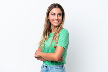 Obraz premium Young Uruguayan woman isolated on white background looking to the side and smiling
