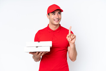 Pizza delivery caucasian man with work uniform picking up pizza boxes isolated on white background...