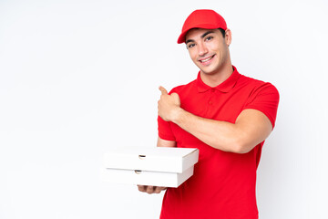 Pizza delivery caucasian man with work uniform picking up pizza boxes isolated on white background...