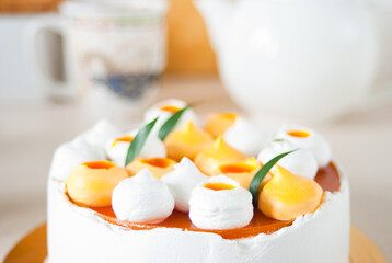 round cake close-up in the background mug and teapot