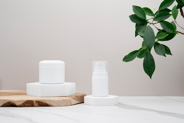 Fototapeta na wymiar Cosmetic product mockup on ocher background and white marble stand. Presentation of products on a podium, plants nearby