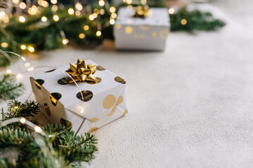 Christmas background , gift box with a Golden bow on the background of Christmas bokeh