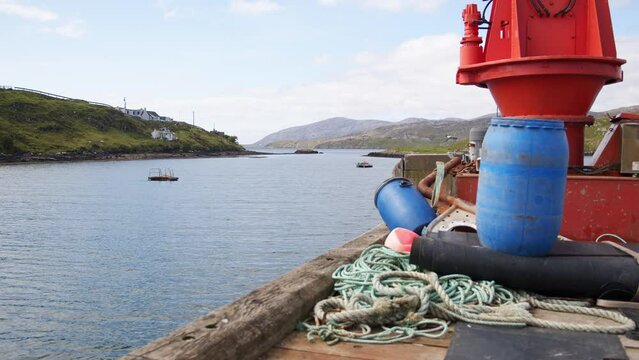 Static shot of the harbour, dock and pier on the Isle of Scalpay.