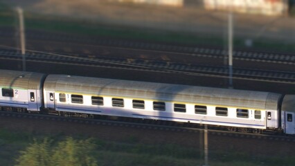 Aerial of Electric Passenger Train on Multiple Tracks Railway Tracking Shot