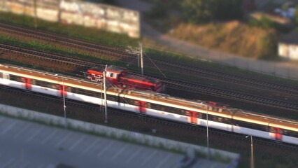Aerial of Electric Passenger Train and Locomotive on Railway Tilt-Shift