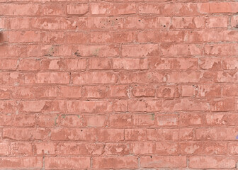 an old peeling red brick wall.