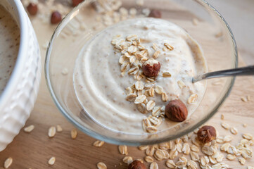 Breakfast cereal bowl with yoghurt, dried figs, oats and nuts