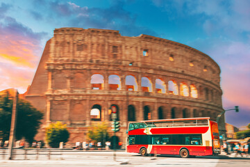Rome, Italy. Amazing Scenic View Colorful Sky Above Colosseum. Red Hop On Hop Off Touristic Bus For...