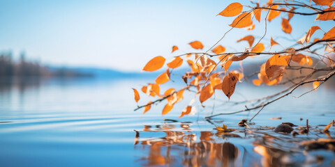 Autumn landscape. Fiery shades of autumn foliage and the cool deep blue of the lake.