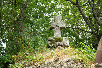 Christian cross made by stone in outdoor.