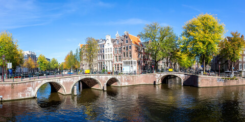 Canal and bridges traditional Dutch houses panorama at Keizersgracht in Amsterdam, Netherlands