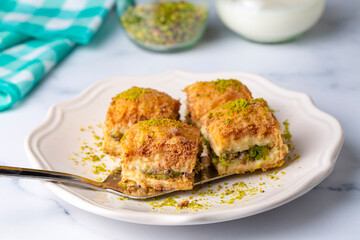 Traditional turkish new dessert cold milky baklava with pistachio (Turkish name; soguk baklava)