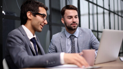 Business people discussing over new business project in office.