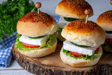 Mini sandwiches with feta cheese, tomato and cucumber.