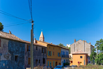 Scenic view of church tower and cityscape of Giens village on a sunny late spring day. Photo taken June 8th, 2023, Giens, Hyères France.
