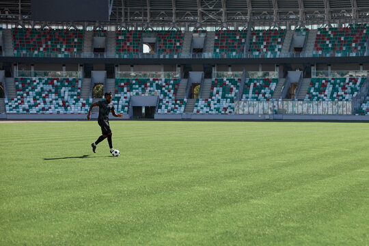 Professional football player in action at the stadium.