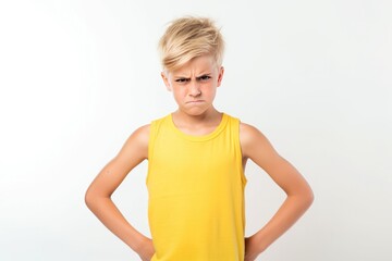 Anger European Boy In A Yellow Tank Top On White Background. Сoncept Expressing Anger, European Teenagers, Yellow Tank Tops, White Backgrounds - obrazy, fototapety, plakaty