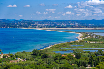 Aerial view of Giens peninsula on a sunny spring day with Mediterranean Sea, saline and beach in the background. Photo taken June 8th, 2023, Giens, France.