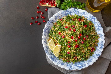 Tabbouleh salad is a traditional middle eastern or arab dish. Vegetarian salad with parsley, mint, bulgur, tomato. Turkish name; Tabule salatasi