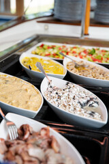 Variety dishes served buffet dinner. Mediterranean ketogenic diet, fish and vegetables. Healthy dinner restaurant buffet menu