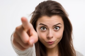 Fototapeta premium Close-up portrait photography of a glad girl in her 20s making a i have an idea gesture with a finger up against a white background. With generative AI technology