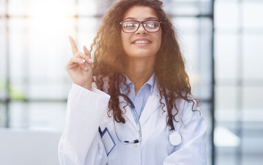 Female doctor pointing her finger for copy