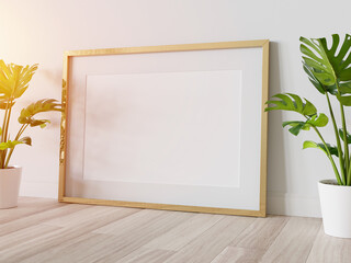 Golden frame leaning on floor in interior mockup. Template of a picture framed on a wall 3D rendering