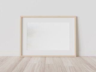 Fototapeta na wymiar Wooden frame leaning on floor in interior mockup. Template of a picture framed on a wall 3D rendering