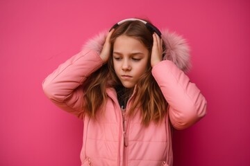 Lifestyle portrait photography of a tender kid female covering his ears against a hot pink background. With generative AI technology