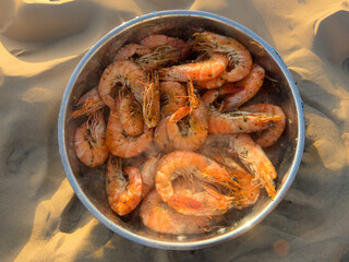 Grilling shrimp on the beach on vacation