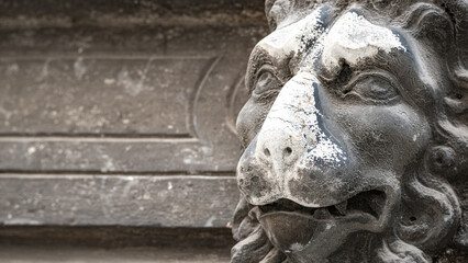 Venice, Italy - Ancient decoration element of a scary but smiling lion head in Venice historical...