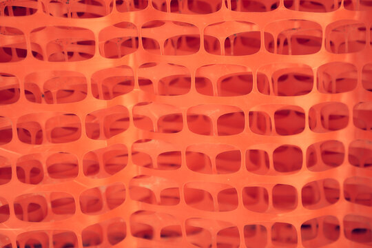 Reinforcing Mesh For Plaster. Orange Construction Mesh In Rolls In A Hardware Store. Mesh For Reinforcing Walls In The Process Of Their Insulation, Rolled Into A Roll. High Quality Photo