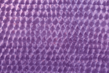 A holographic surface of lilac color with space for copying. Iridescent film texture. High quality...