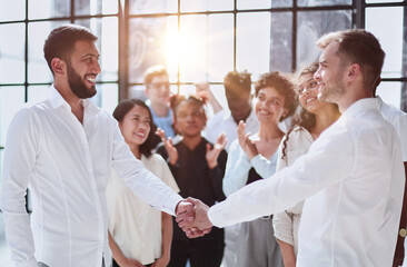 close up. successful business people shaking hands