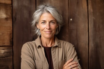 Fototapeta premium Close-up portrait photography of a beautiful mature woman pointing empty space against a rustic brown background. With generative AI technology