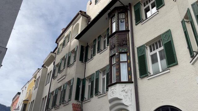 White facade of Kufstein town building on walking tour. European old cities travel destination concept