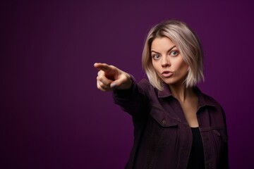 Medium shot portrait photography of a beautiful girl in her 30s pointing at oneself against a deep purple background. With generative AI technology