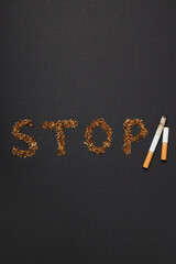 Smoking addiction concept, word: STOP, top view.