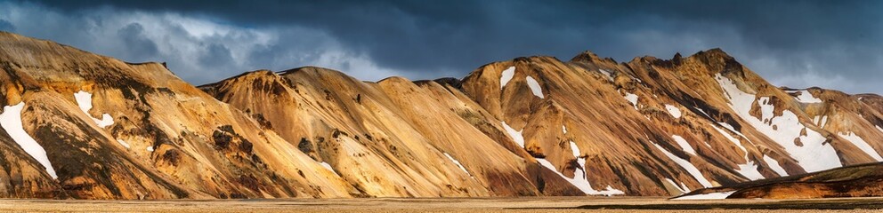 Icelandic volcanic mountain with dramatic sky on wilderness in Landmannalaugar at Iceland