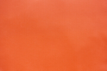 Orange brown artificial leather texture background, close up shot and free space for text present