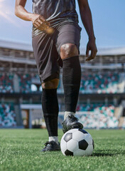 african american man holding a soccer ball in the stadium © Katsiaryna
