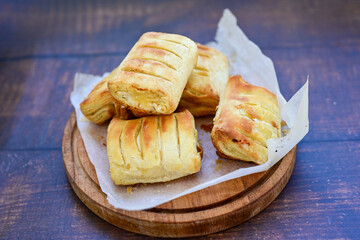Fresh baked home made  Mini cheese puff pastries.Cheese pie with phyllo pastry and herbs