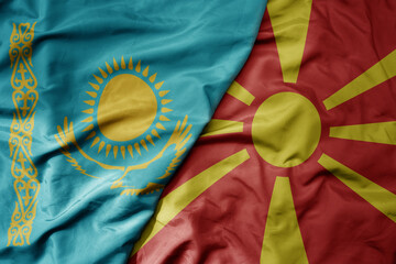 big waving national colorful flag of kazakhstan and national flag of macedonia .